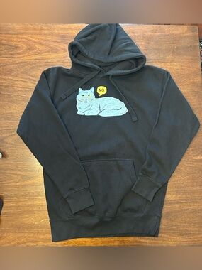 Heritage Black Hoodie with Light Blue Cat and Yellow Speech Bubble